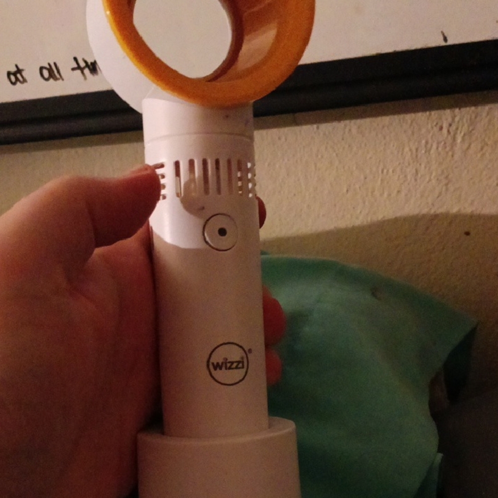 White and Orange Handheld Fan